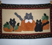 black cats in the pumpkin patch wool applique quilted wallhanging