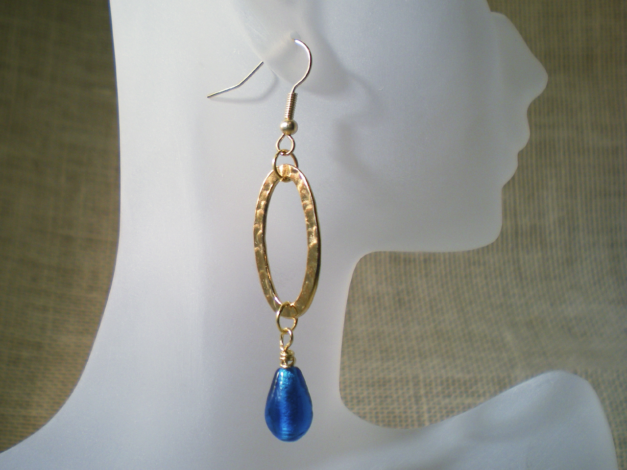 gold-oval-blue-teardrop-earrings-still-on-form