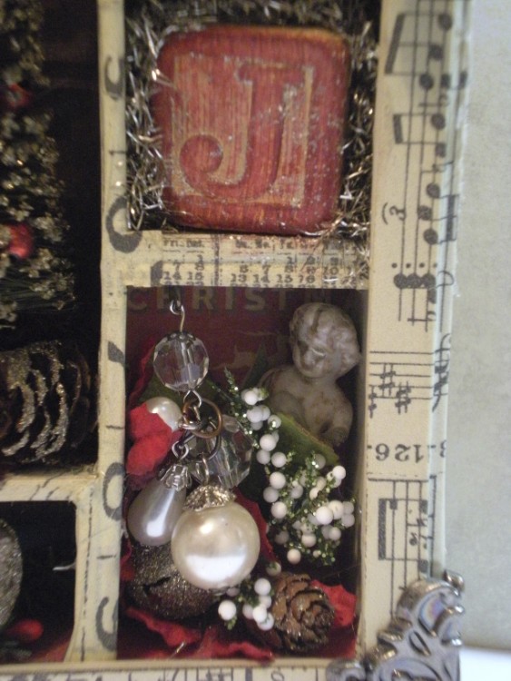 christmas configuration Tim Holtz doll and pearls close up