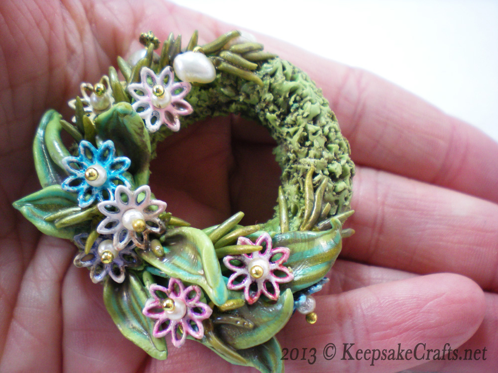 clay-flower-wreath-in-hand