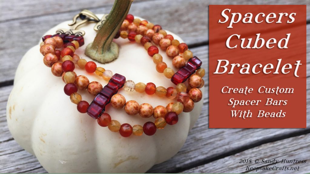 a red, yellow and orange 3 strand bracelet on a cream miniature pumpkin with the title Spacers Cubed Bracelet, Create Custom Spacer Bars with Beads