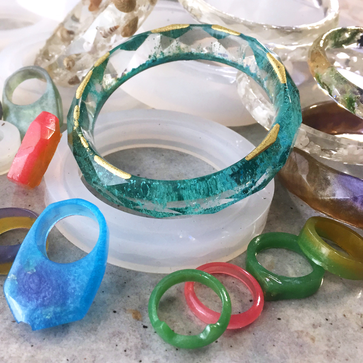 picture of resin jewellery on a pile 