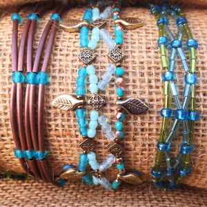 Beaded bracelets with turquiose, green, copper and gold beads.