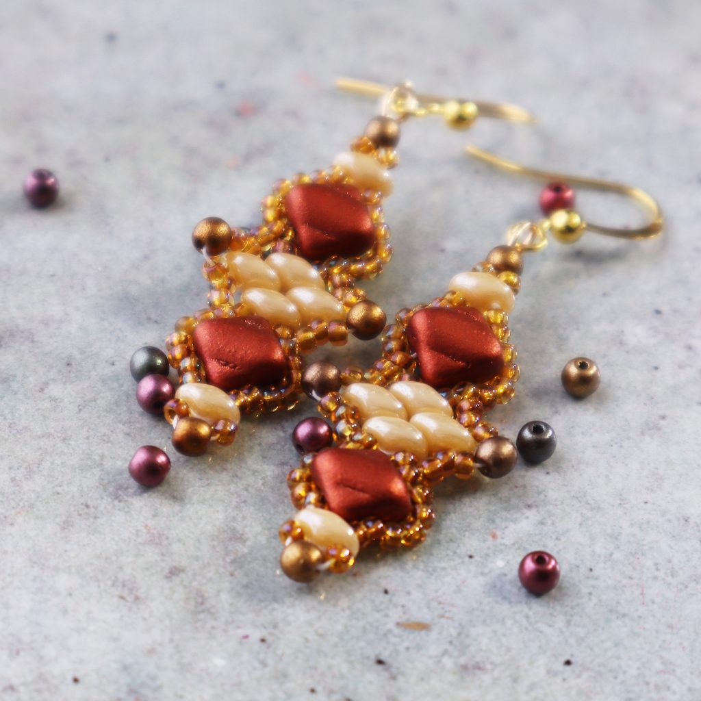 Red, gold and cream colored beaded earrings, made with square silky beads, superduo beads, 3mm round beads and 11/0 seed beads