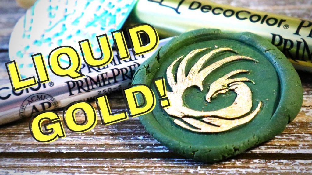 a green form with the appearance of a wax seal with an embossed dragon design colored in gold, yellow text says, "Liquid Gold!"